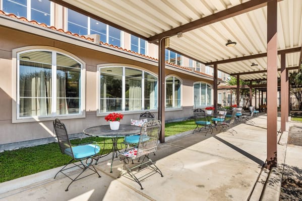 Outdoor seating area with tables and chairs