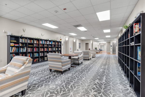 Bright interior of a common area with bookshelves