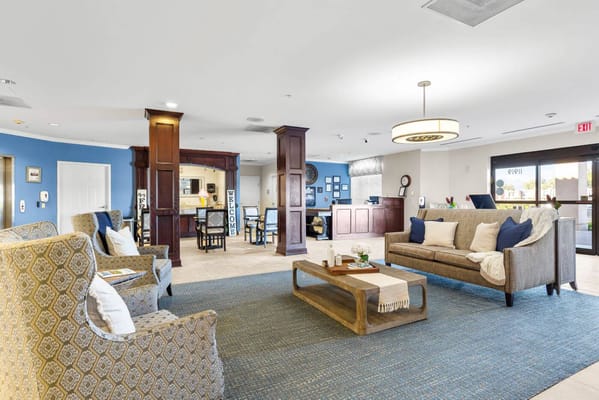 Bright common area with seating and reception desk