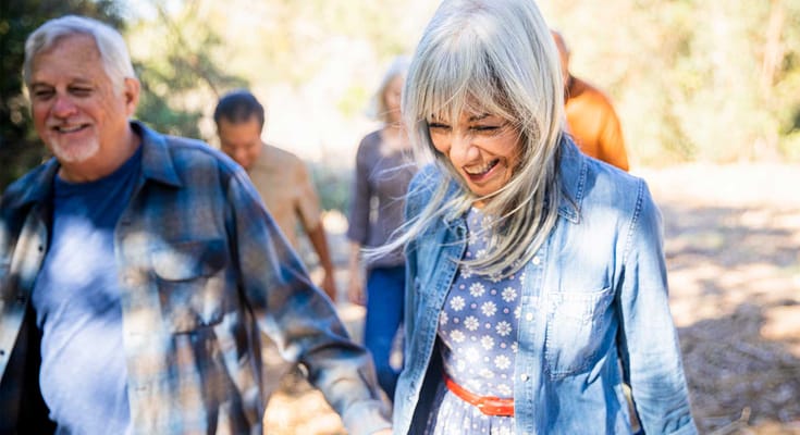 Residents enjoying a walk in a natural outdoor setting