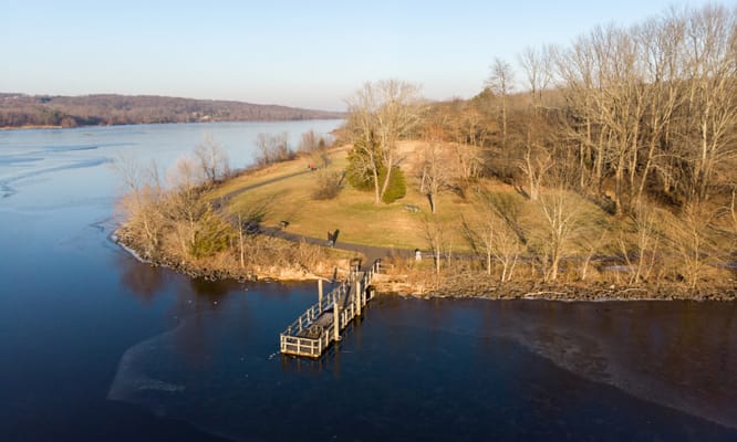 Aerial view of a peaceful park by the river