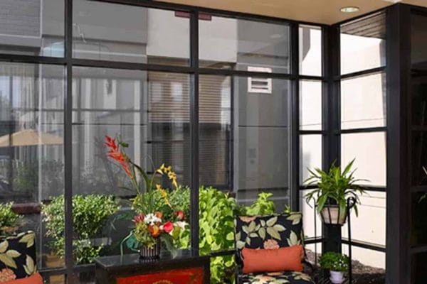 Bright interior space with plants and seating area