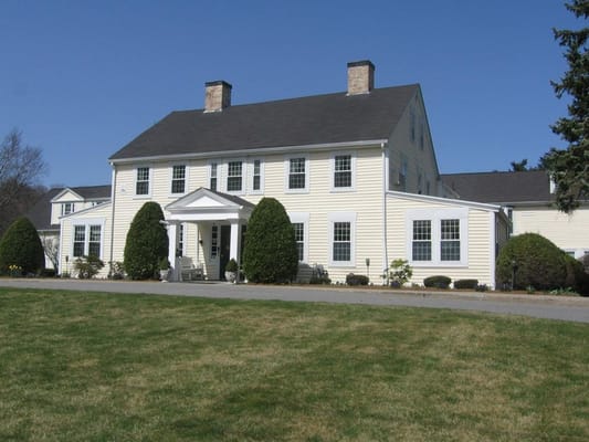 Exterior view of Pond Home facility with landscaped grounds