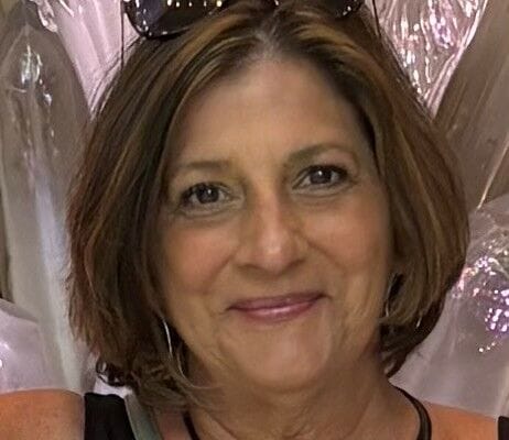 A smiling resident portrait with a welcoming expression