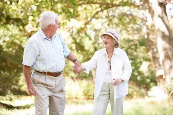 Seniors enjoying a walk in a garden