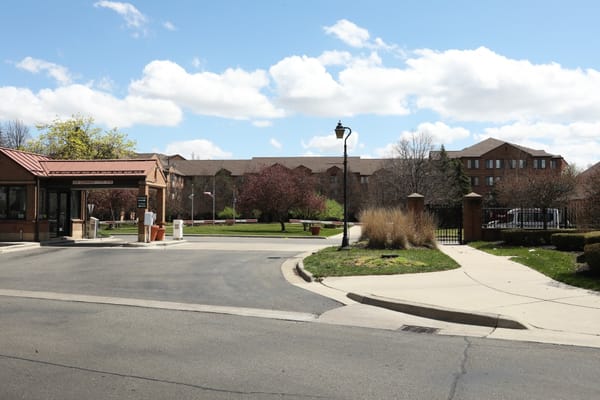 Entrance of Allegria Village with landscaped outdoor space