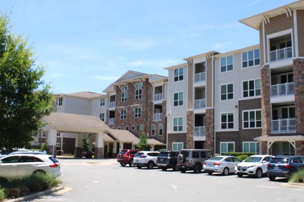Exterior of Verena at Bedford Falls with parking area