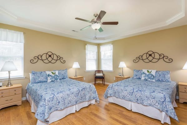 Brightly lit shared resident bedroom with two beds