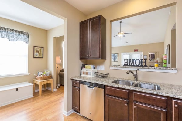 Bright kitchen area with a view into the living space