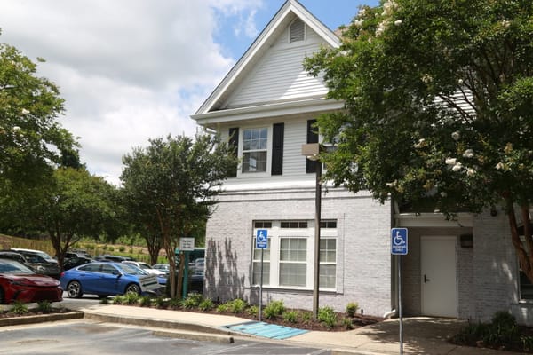 Facade of a senior living facility with accessible parking