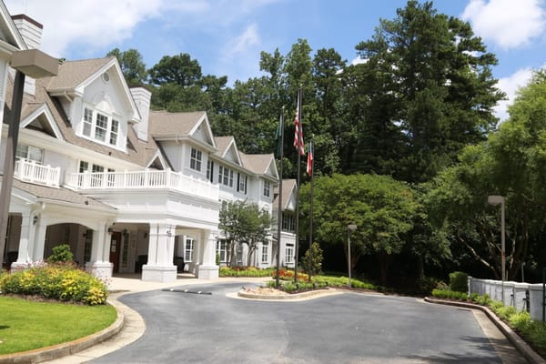 Exterior view of PruittPlace Buckhead with landscaping
