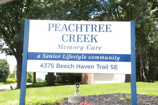 Sign for Peachtree Creek Memory Care facility