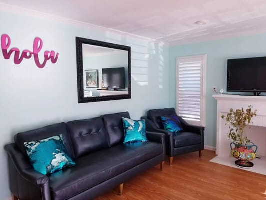 Cozy common area with blue walls and comfortable furniture