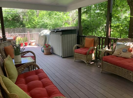 Patio with seating and greenery at Assured Serenity 19
