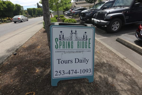 Sign for Spring Ridge Assisted Living, promoting tours