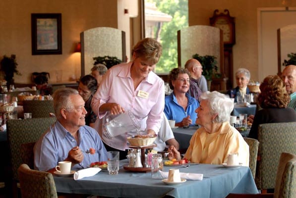Residents enjoying a meal in the dining room