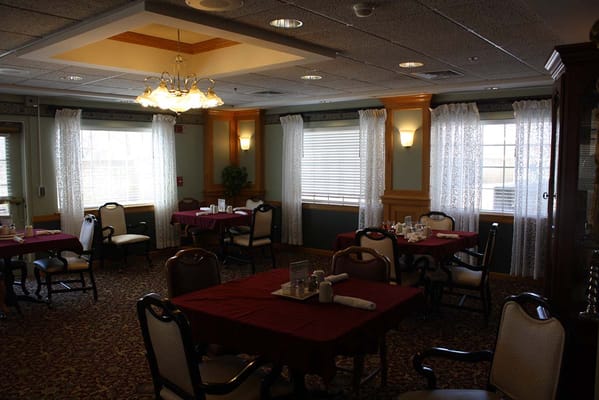 Dining area with tables set for residents
