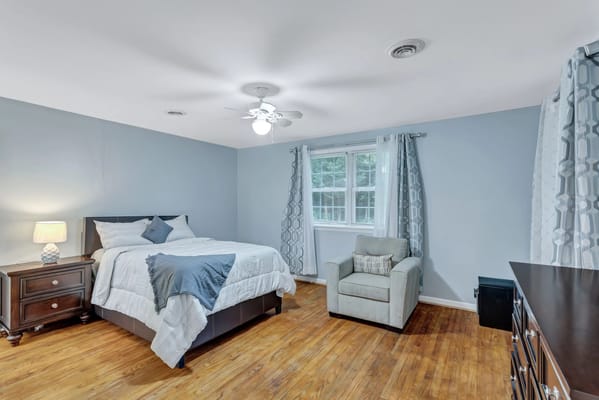 Cozy private resident room with wooden flooring