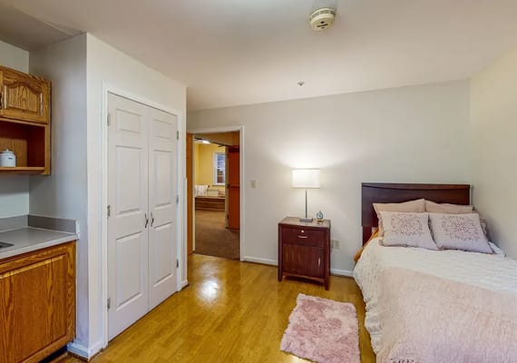 Private resident room with bed and furniture