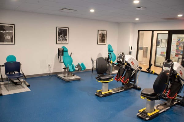 Interior view of an exercise room with fitness equipment