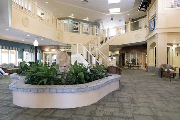 Interior view of a spacious common area with plants