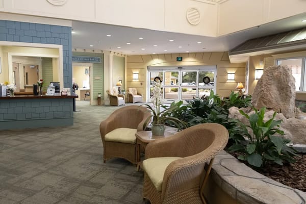 Bright interior common area with seating and plants