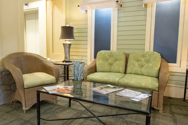 A cozy interior seating area with green furniture