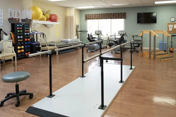 Interior view of a rehabilitation space with therapy equipment