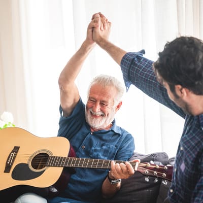 Residents enjoying music during a group activity
