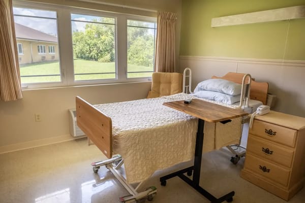 A well-furnished private resident room with a view