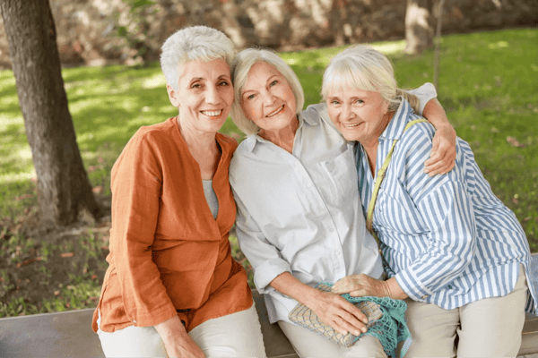 Three senior women enjoying time together outdoors