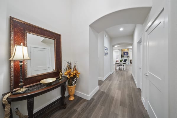A well-decorated interior hallway with furniture and decor
