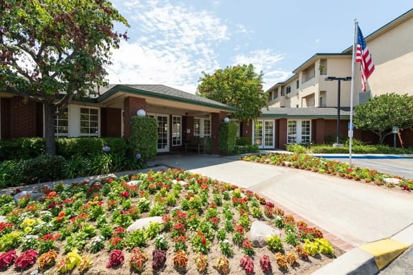 Entrance of Carmel Village with colorful flowers