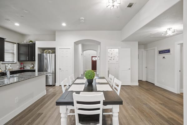 Interior view of a modern dining area with table and chairs
