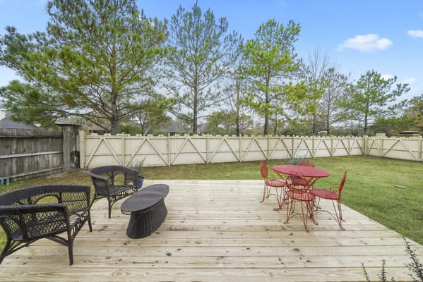 Outdoor seating area with red and black chairs
