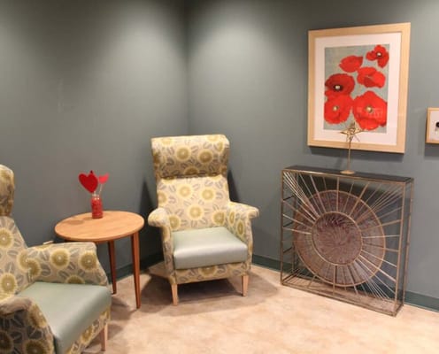 Comfortable seating area with art on the wall