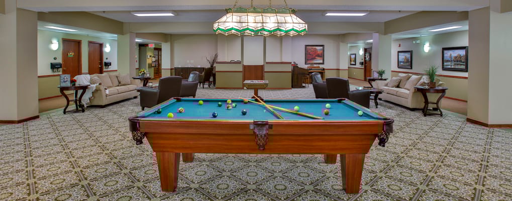 Common area with a billiards table and seating