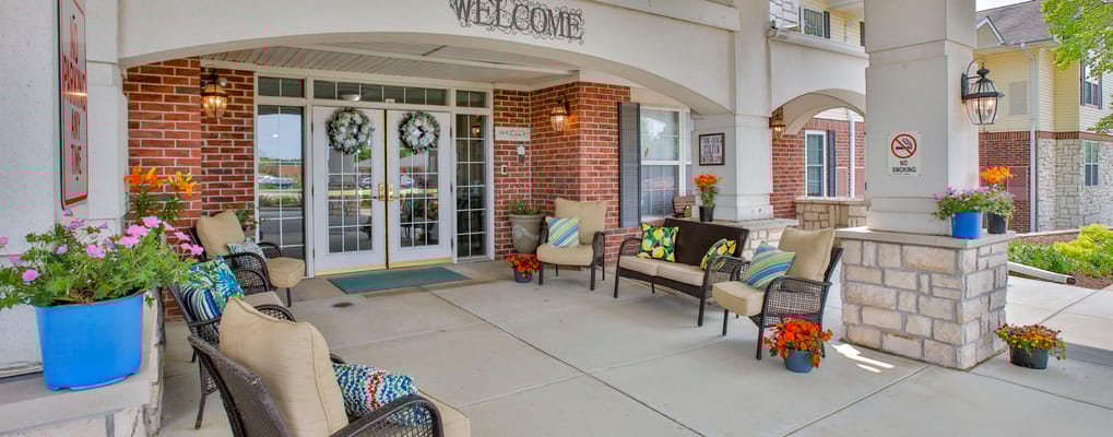 Welcoming entrance with seating and flowers