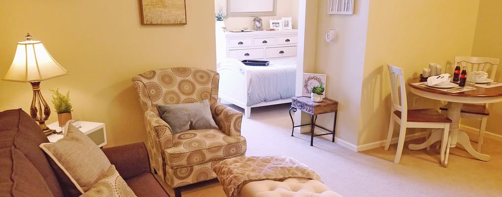 Bright and cozy living area in a resident room