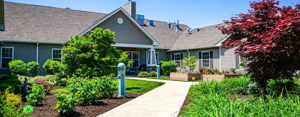 Well-maintained outdoor garden pathway with flowers