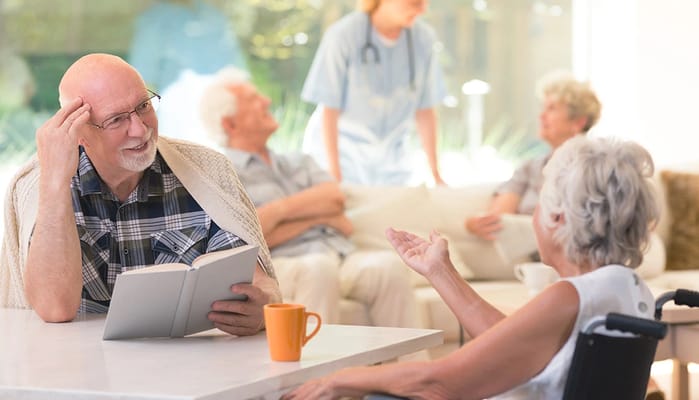Residents engaging in conversation in a common area