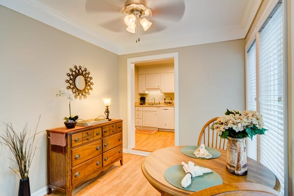 Cozy dining area with wooden furniture and decor