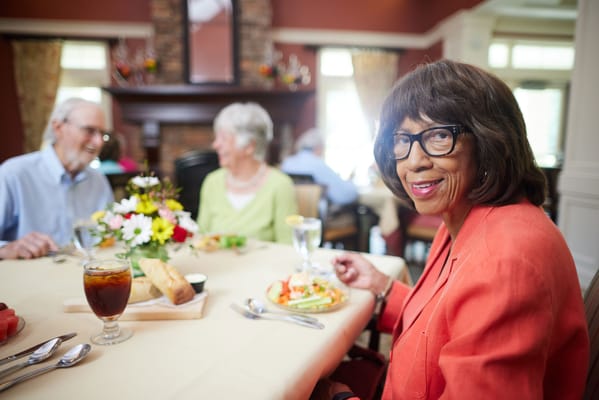 Residents enjoying a meal in a dining room