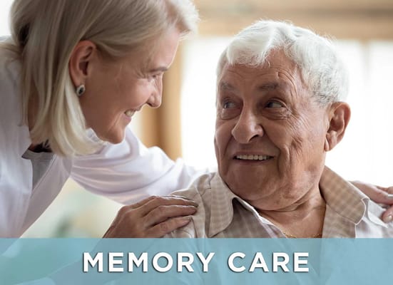 A caregiver smiling at an elderly resident