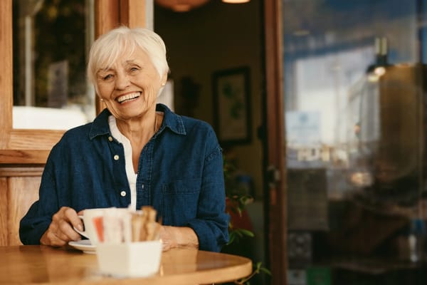 Senior woman enjoying coffee in a cozy setting