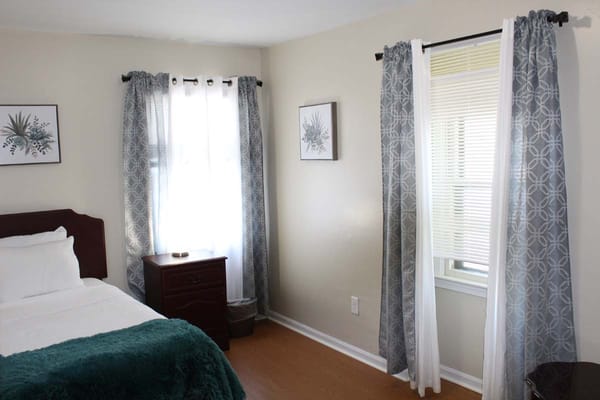 Cozy resident room with a bed and natural light