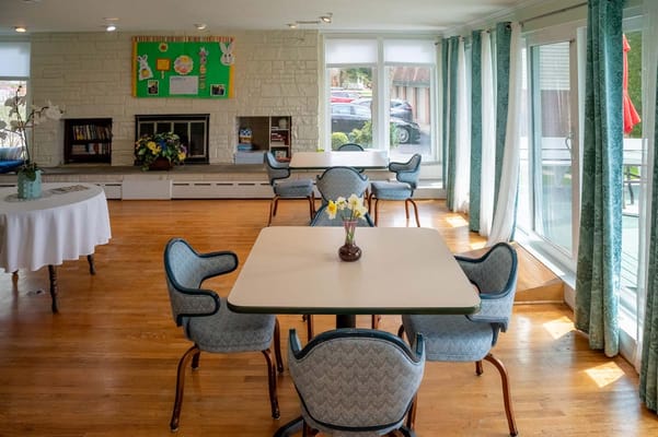 Bright common area with tables and chairs