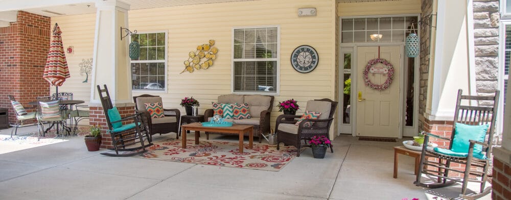 Outdoor seating area with plants and decor