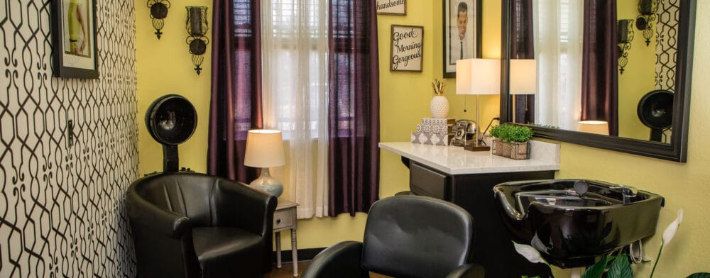 Interior view of a hair salon with seating and decor