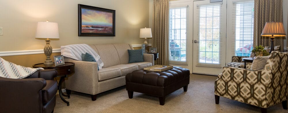 Cozy living room area with a sofa and chairs